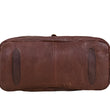 Load image into Gallery viewer, Brown leather duffel bag on a light wooden surface