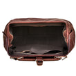 Load image into Gallery viewer, Brown leather duffel bag on a light wooden surface