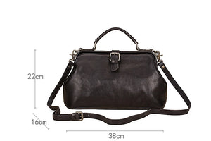 Black leather handbag with measurements on a white background