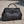 Load image into Gallery viewer, Black leather handbag on a light wooden surface
