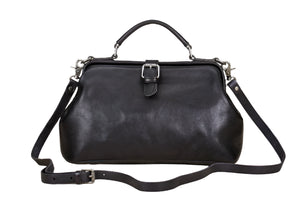 Black leather handbag with a strap on a light background