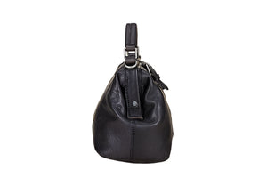 Black leather handbag on a light wooden surface