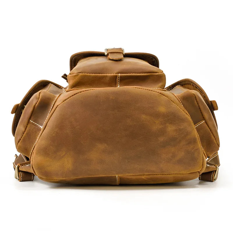 Brown leather backpack on a white background