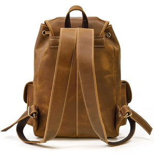 Brown leather backpack on a white background