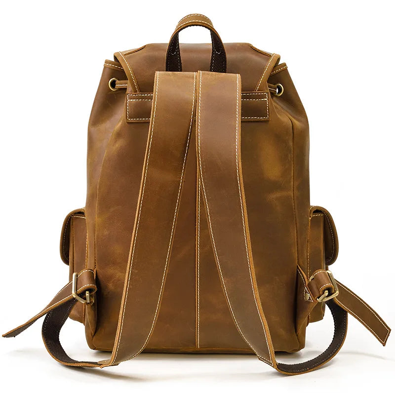 Brown leather backpack on a white background