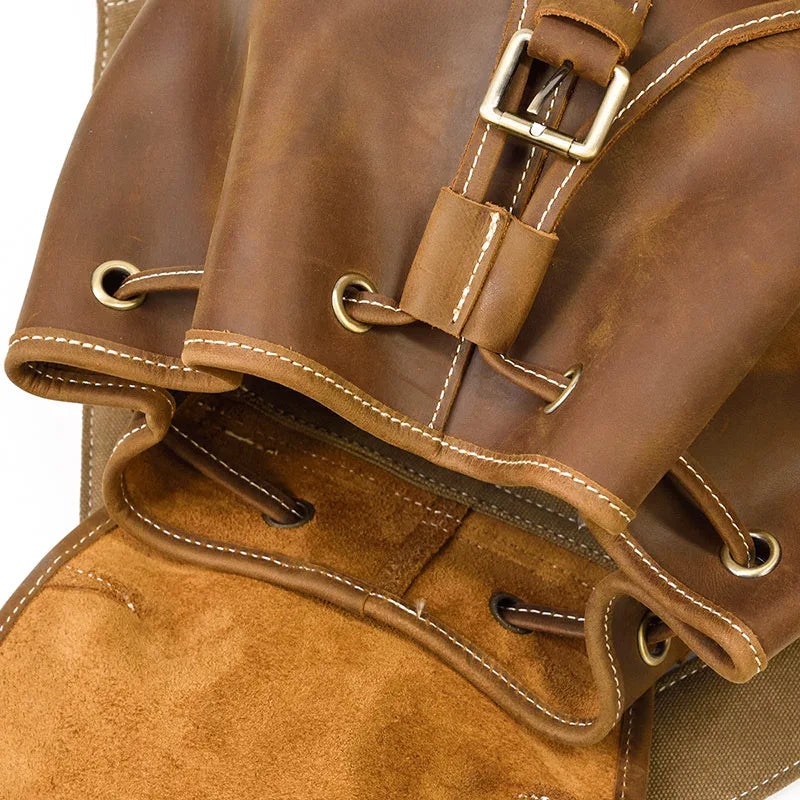 Close-up of a brown leather bag with a buckle on a white background
