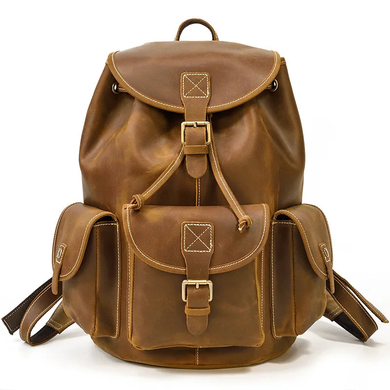 Brown leather backpack on a white background