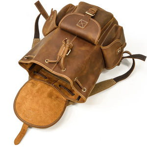 Brown leather backpack on a white background