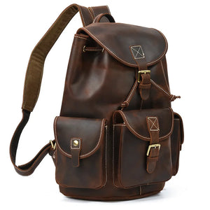 Brown leather backpack on a white background