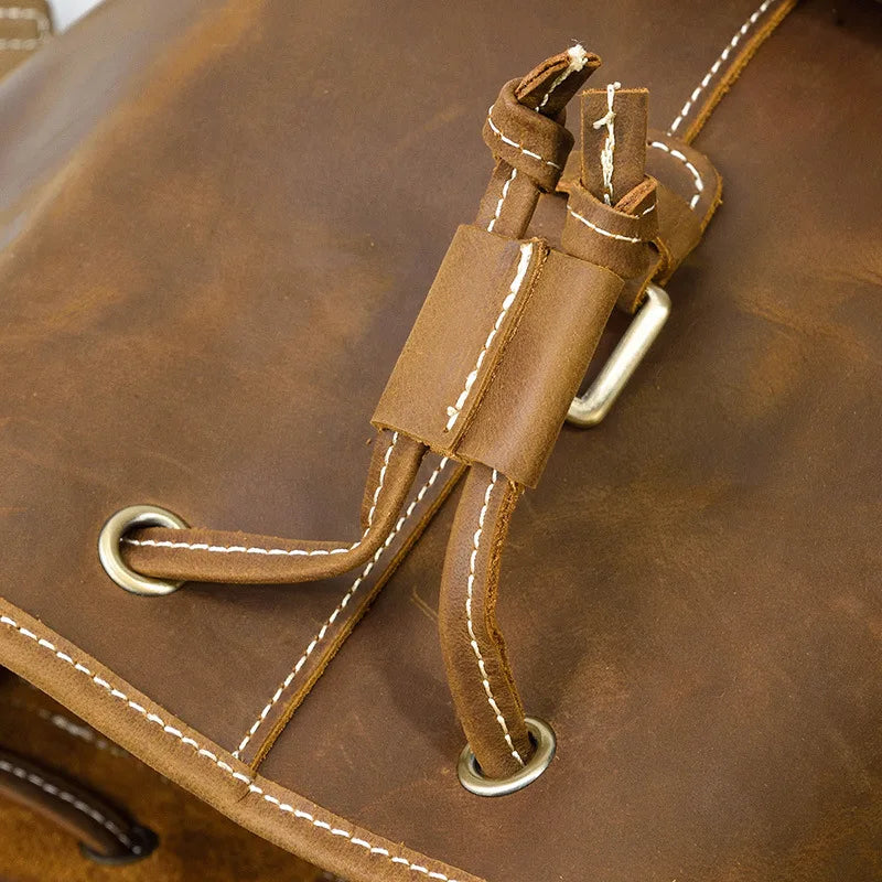 Close-up of a brown leather bag with stitching details
