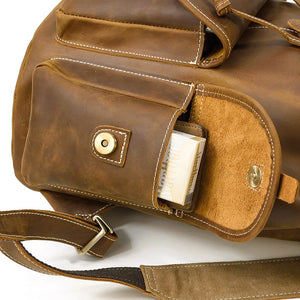 Brown leather bag with a pocket open, showing a white paper inside, on a white background