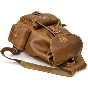 Brown leather backpack on a white background