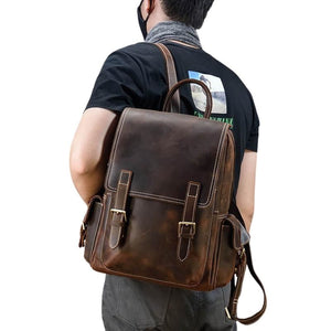 Man having brown backpack on shoulder